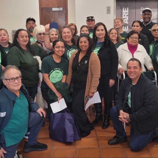 Union members celebrating a signed contract with the Santa Barbara County Board of Supervisors